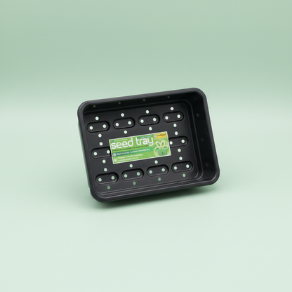 Black seed tray with a green label on a light green background