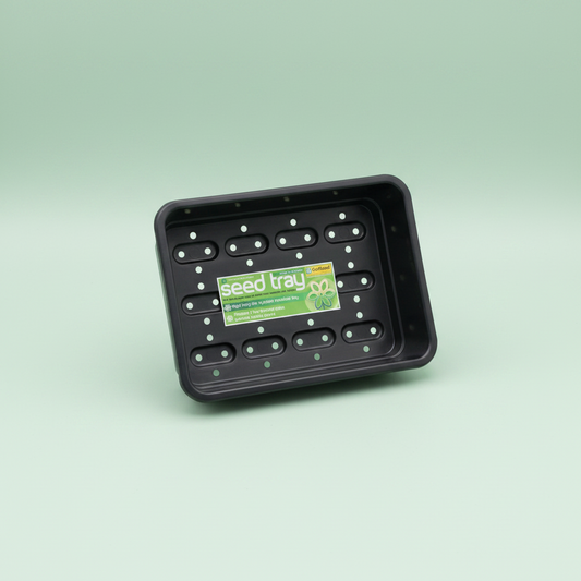 Black seed tray with a green label on a light green background